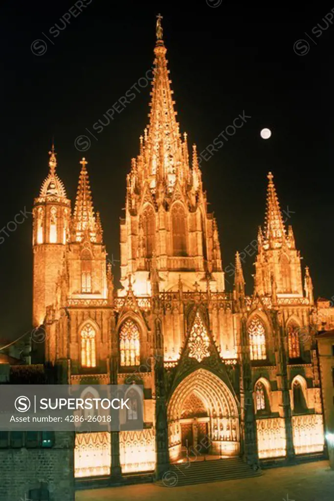 The Cathedral at night under full moon in Barcelona Spain