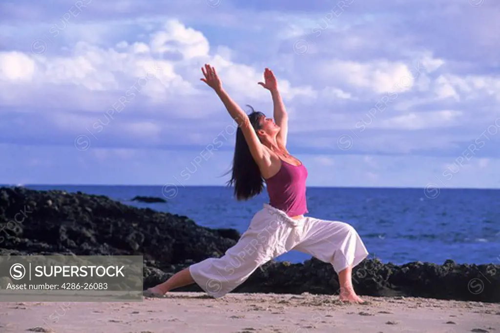 Woman doing yoga exercises in Laguna Beach California