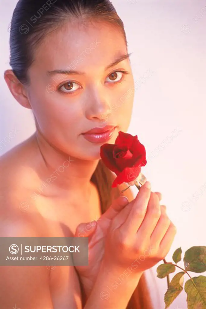 Woman of Spanish Italian Filipino Korean mix with red rose