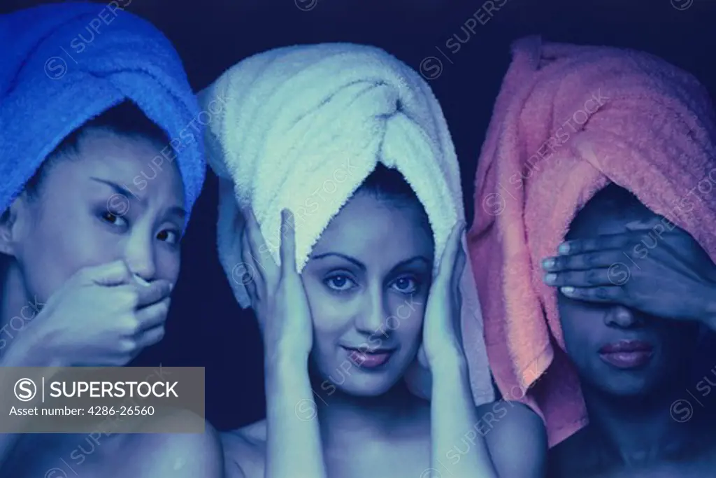 Three women of ethnic mix expressing old Asian proverb with their hands