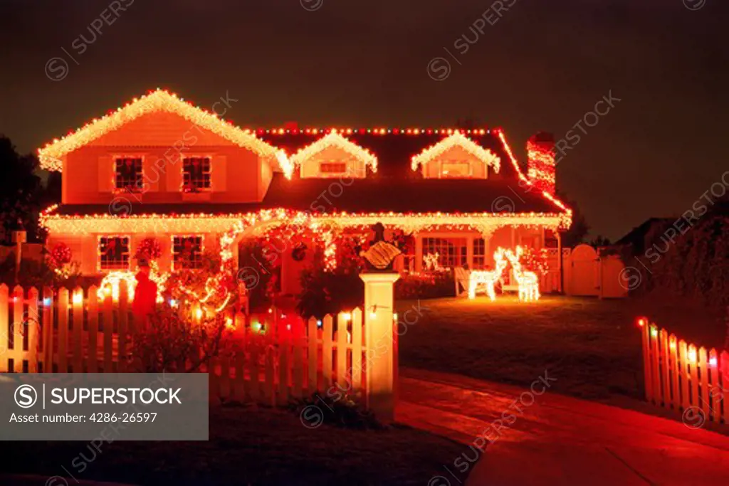 House with Christmas decorations in California at night
