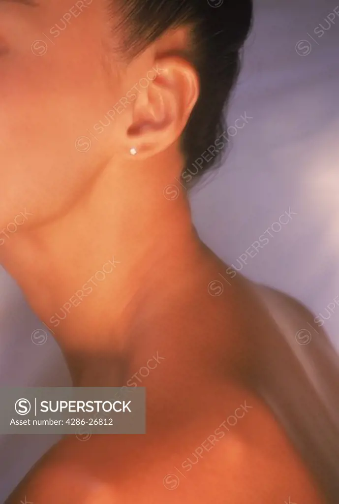 Close up of bare neck and shoulder of Asian woman