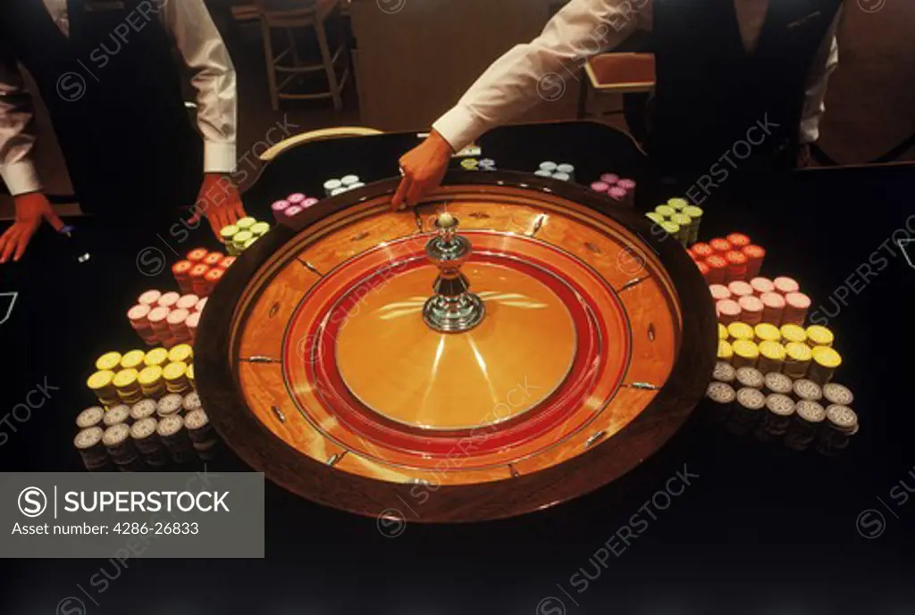 Spinning roulette wheel with chips 