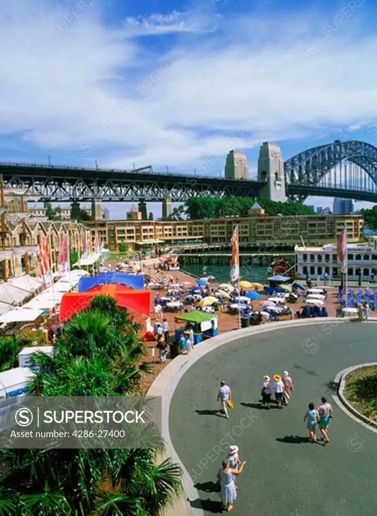 Overview of The Rocks with Sydney Harbour Bridge and sidewalk restaurants