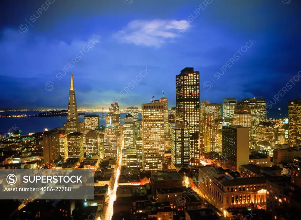 Transamerica Pyramid and Oakland Bay Bridge with San Francisco skyline at twilight