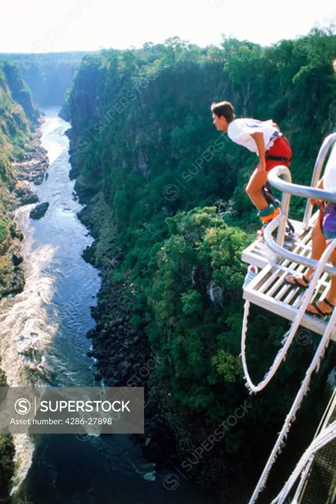 Bungy jumping off 152 meter high Victoria Falls Bridge above Zambezi River between Zambia and Zimbabwe