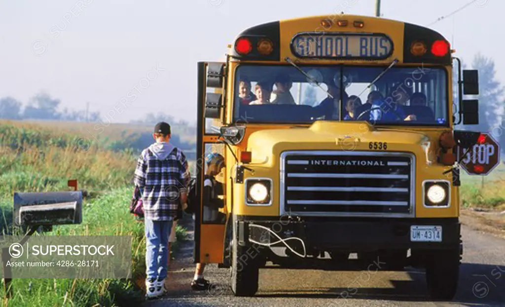 Children boarding a yellow school bus in Northwest USA