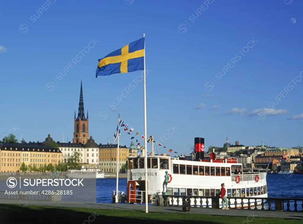 Ferryboat at Stockholm City Hall or Stadshuset on Riddarfjarden across from Riddarholmen