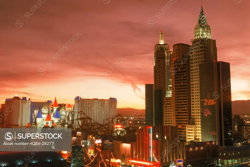 New York New York and Excalibur Hotels on the Strip in Las Vegas at sunset