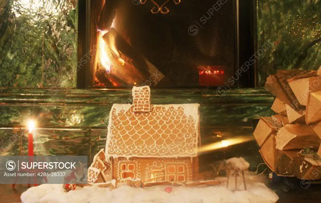 Gingerbread house with fireplace and candles during Christmas Season