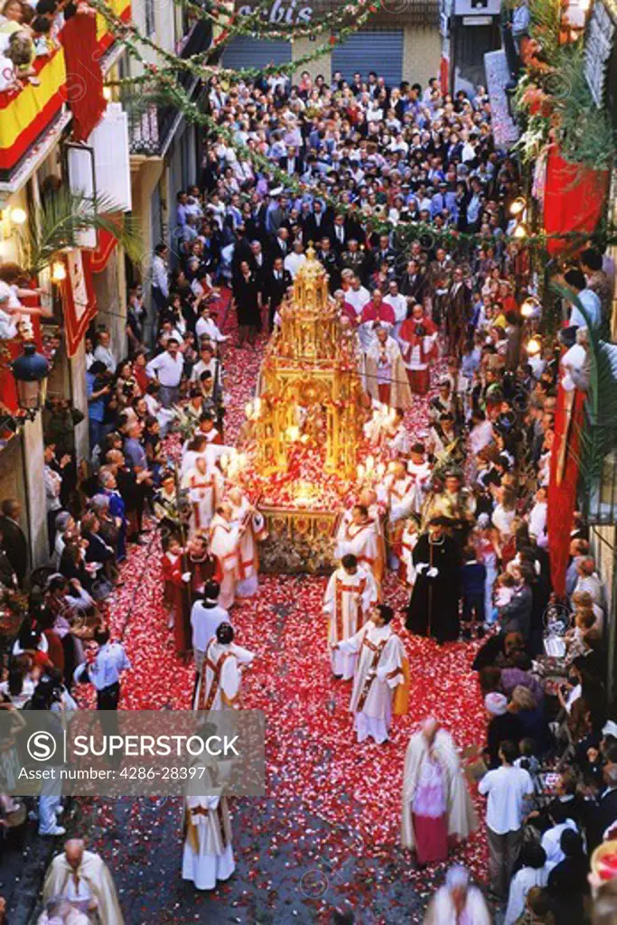 Corpus Christi celebrations with confetti falling on streets of Valencia, Spain