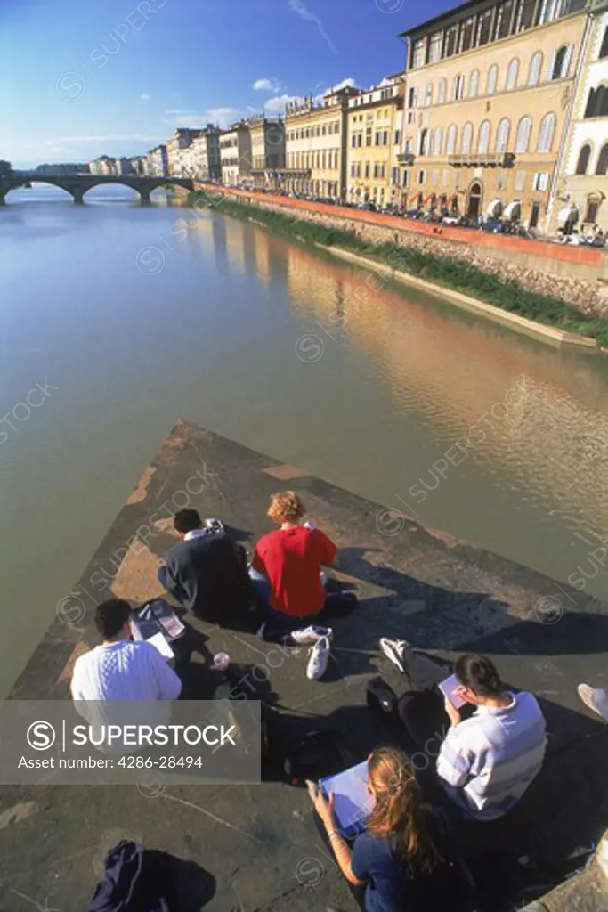 Art students in Florence at Ponte St. Trinita over Arno River