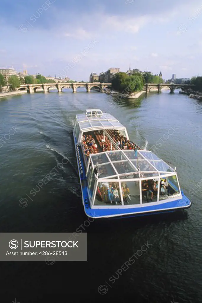 Passenger boat touring Paris on River Seine