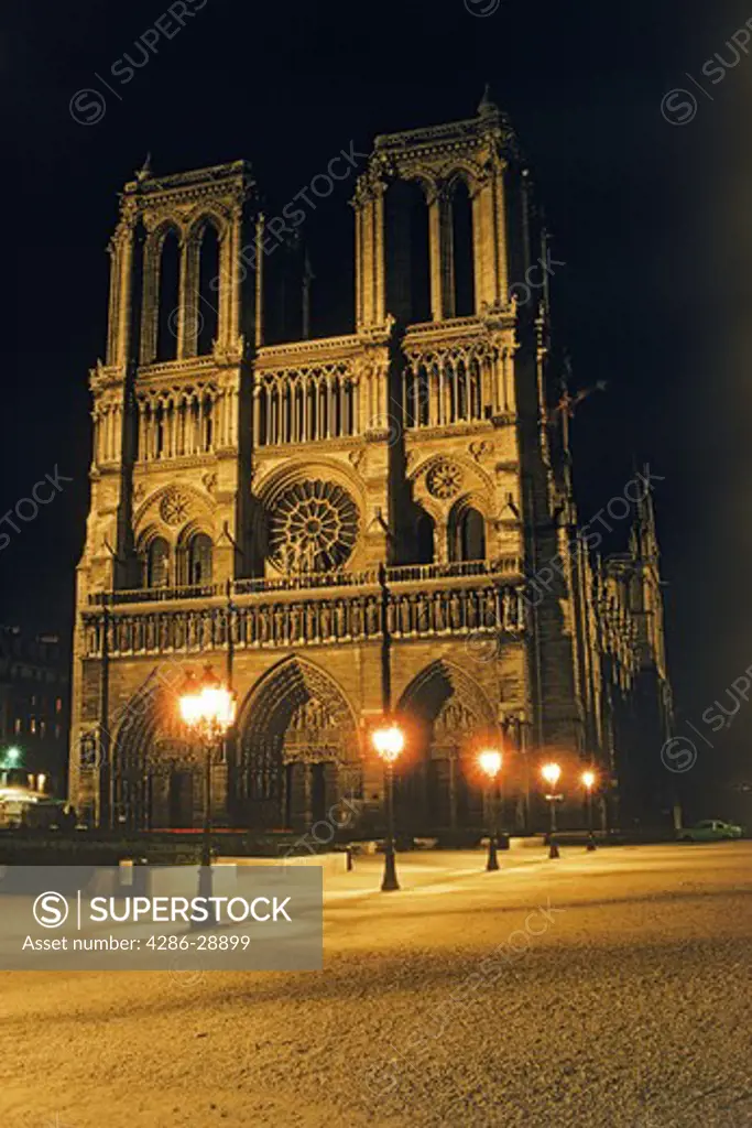 Notre Dame Cathedral on le de la Cite at night in Paris