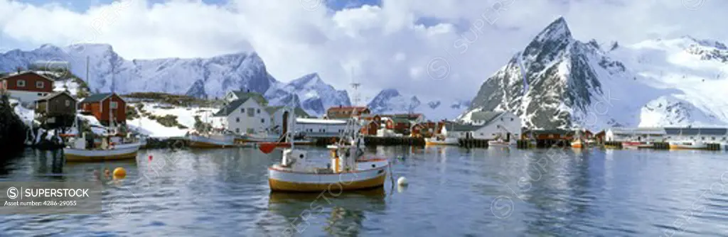 Fishing boats anchored at village of Hamnoy on Moskenes Island in Lofotens off  Northern Norway