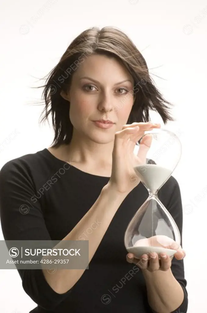 Woman holding an hour-glass, passage of time