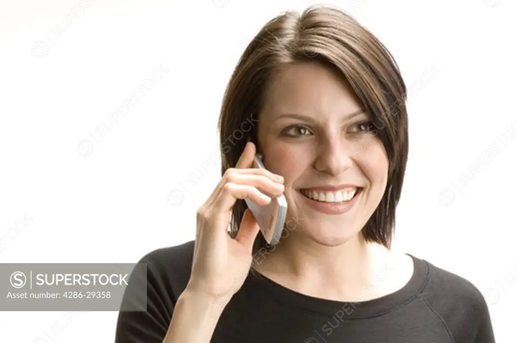 Studio sho tof young woman talking on her cell phone