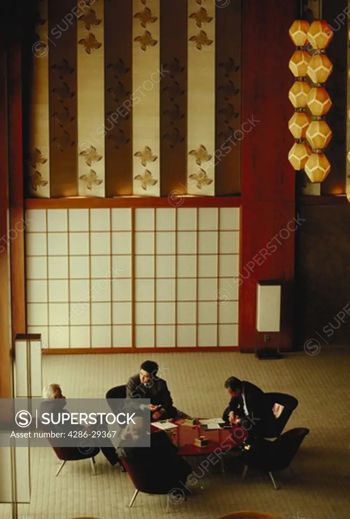 International business executives confer in luxury hotel, Tokyo, Japan.  Total Japan file contains 20,000 images from 40 shoots.
