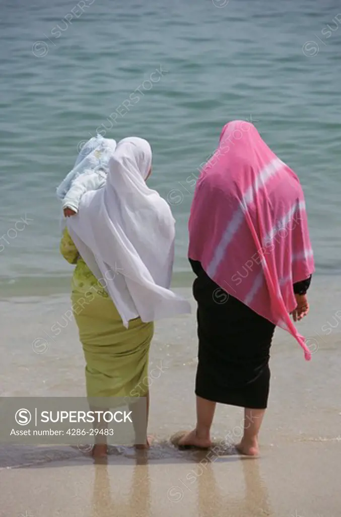 Covered muslim women at the beach, Alexandria, Egypt
