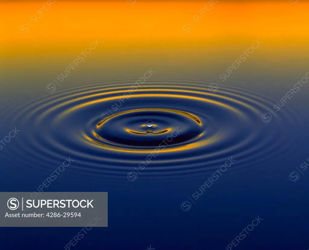 Water droplet on gradient yellow to blue background