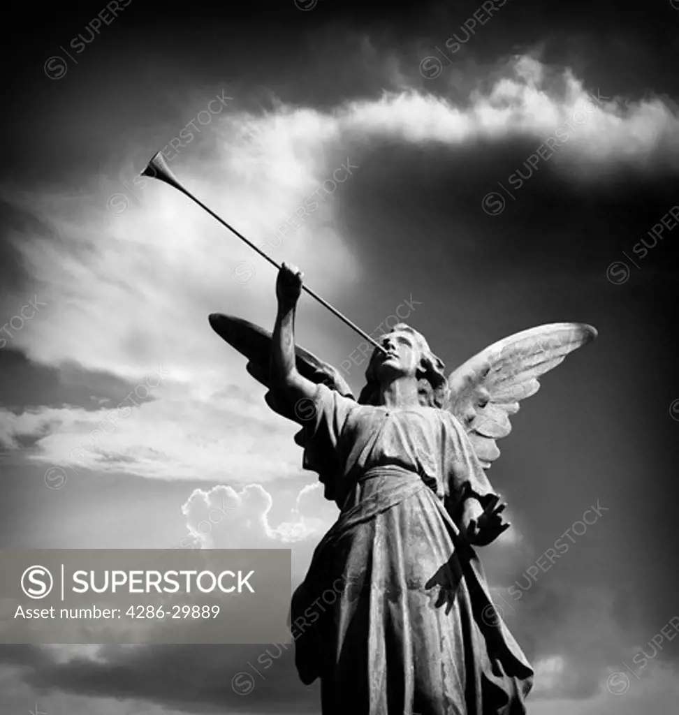 Angel statue blowing horn                              