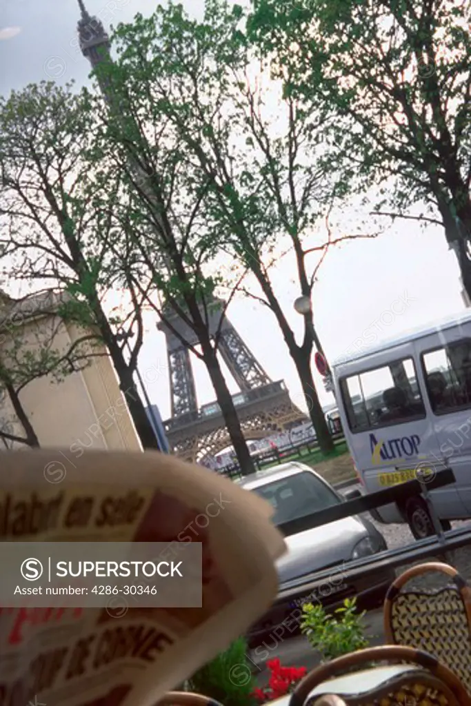 View of the Eiffel Tower through the trees of Trocadero, Paris, France.