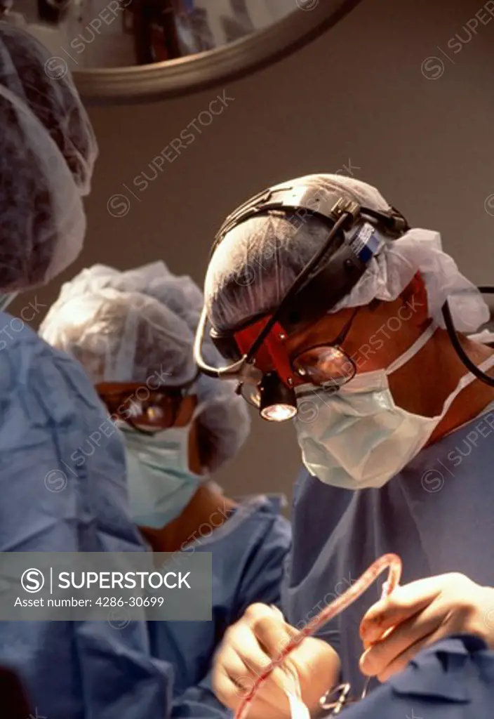 Anterior cervical fusion surgery is reflected in neurologist's glasses.