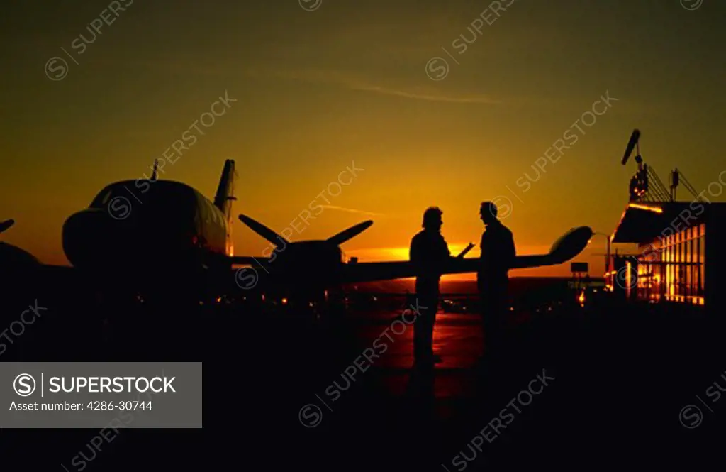 Student and instructor prepare for early morning flight.