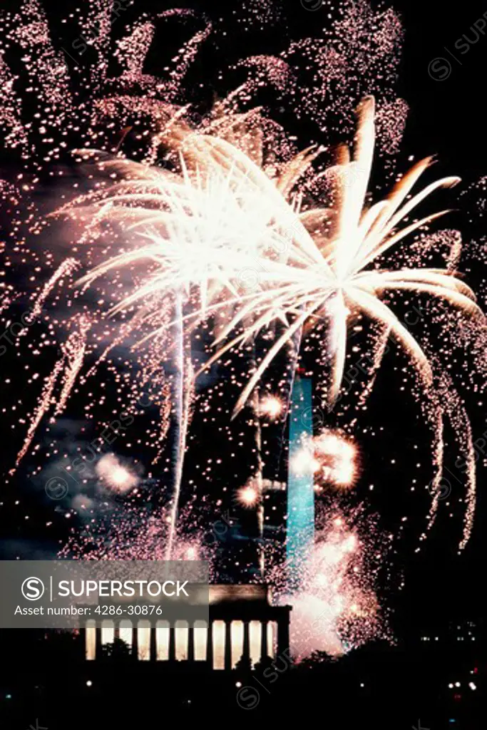 Brilliant fireworks bursting over the Lincoln Memorial and Washington Monument, George H.W. Bush inauguration celebration, 1989.