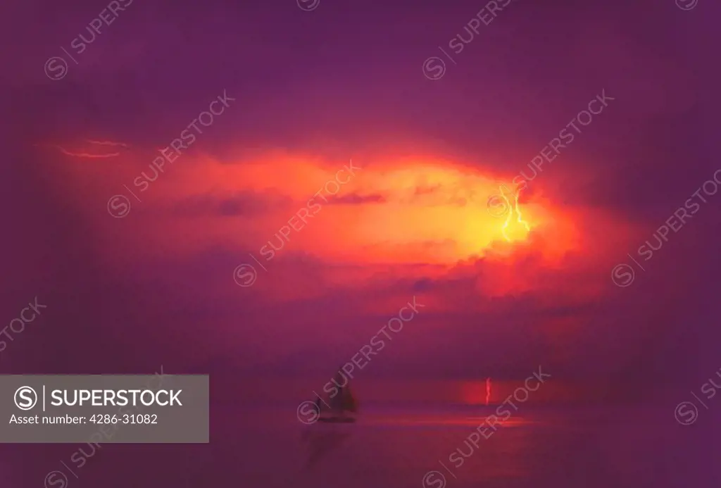 Sailboat on the ocean, with lightning