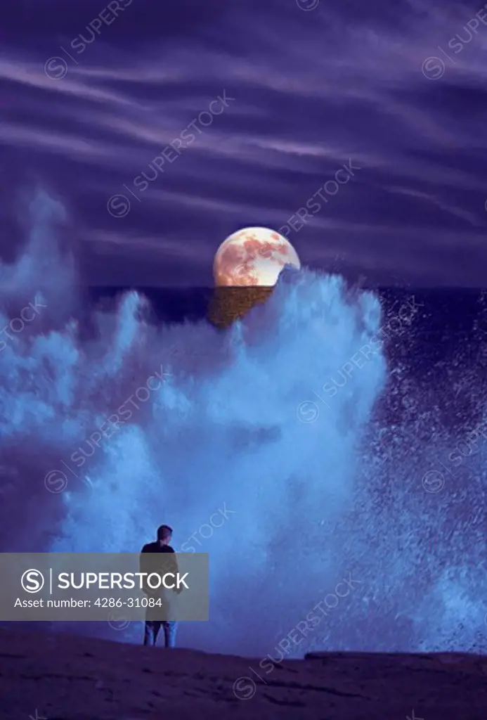 Man with breaking surf and moon on horizon