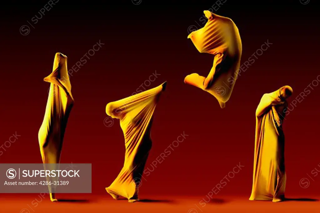 Four dancers wrapped in yellow fabric dancing in different positions.