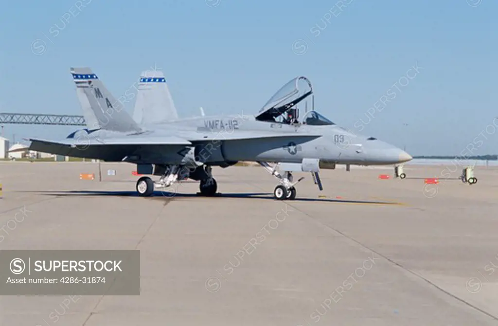Side view of a strike fighter military aircraft on the ground in Ft. Worth, Texas. 