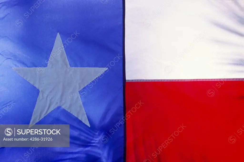 Close-up of the Texas State Flag displaying red, white, and blue and a large white star.