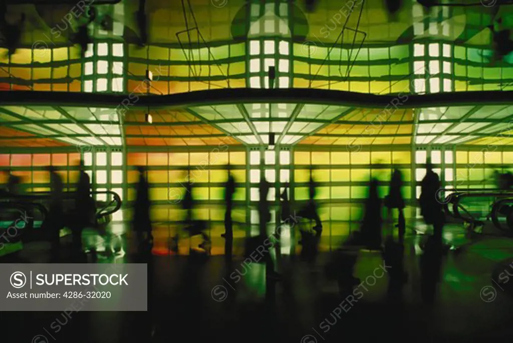OHarie International Airport, Chicago, IL, travelers walking in underground passageway