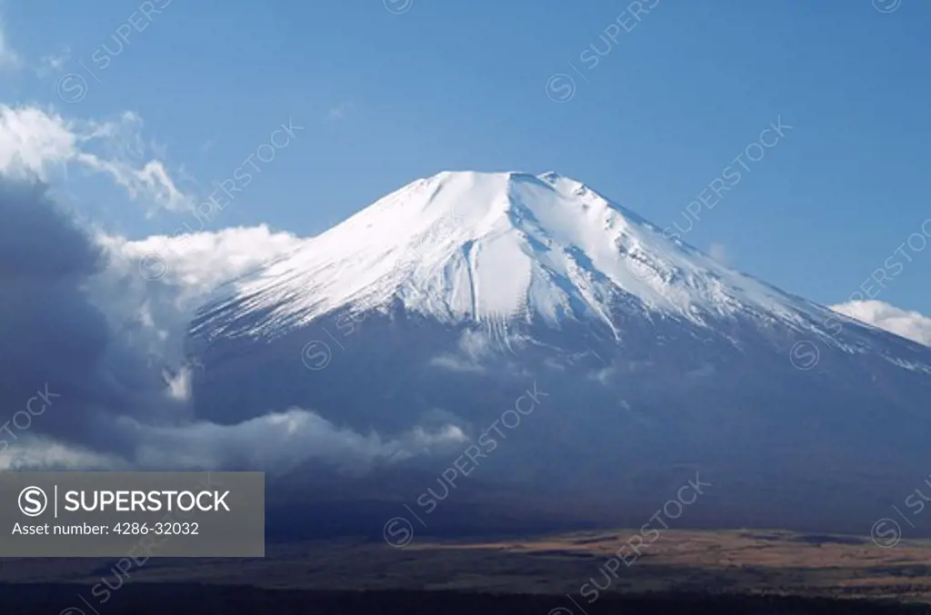 View of a snow capped Mount Fuji near Lake Yamanaka, Fuji-Hakone-Izu National Park, Japan.