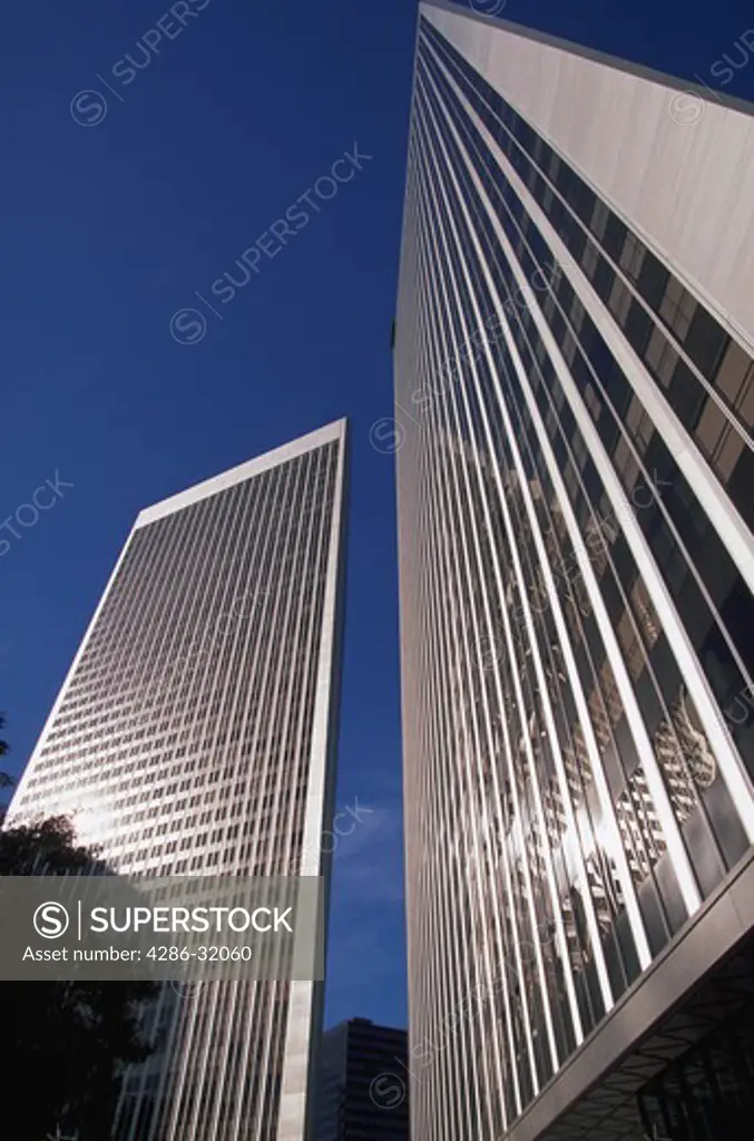 View looking up from street level at the Century Plaza Towers office buildings in Century City, Los Angeles, California.