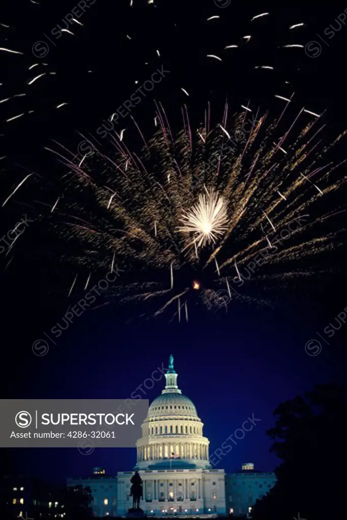 Double exposure shot of fireworks bursting over U.S. Capitol dome, Washington, DC.