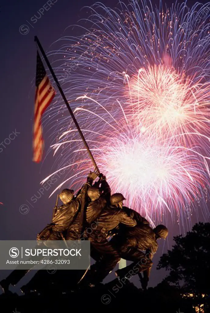 Fireworks bursting behind the Marine Corp Memorial (Iwo Jima Statue).