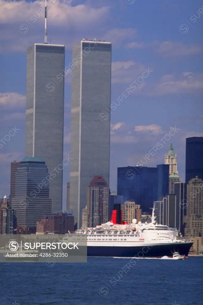 Queen Elizabeth II with World Trade Center twin towers in background, New York City.