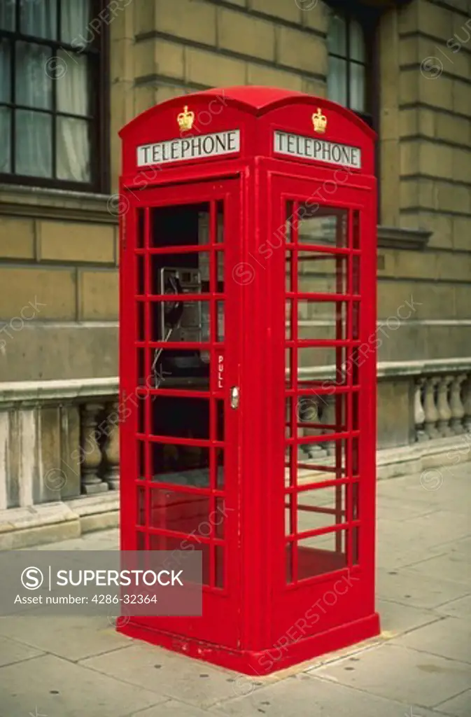 Red public telephone box, London, England.