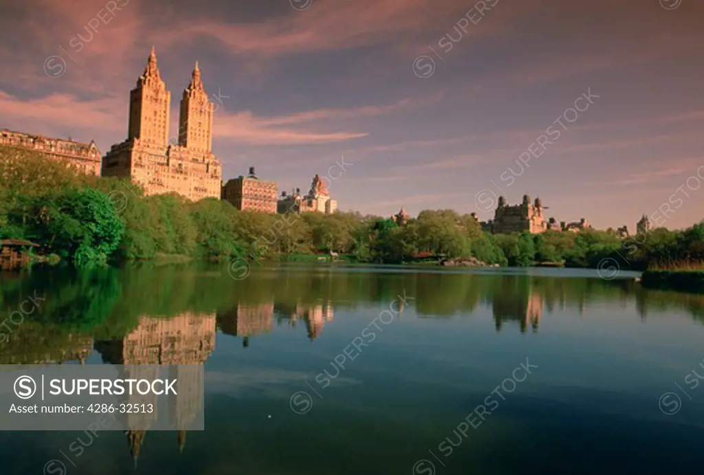 The pond in Central Park with partial skyline, New York City, NY. 