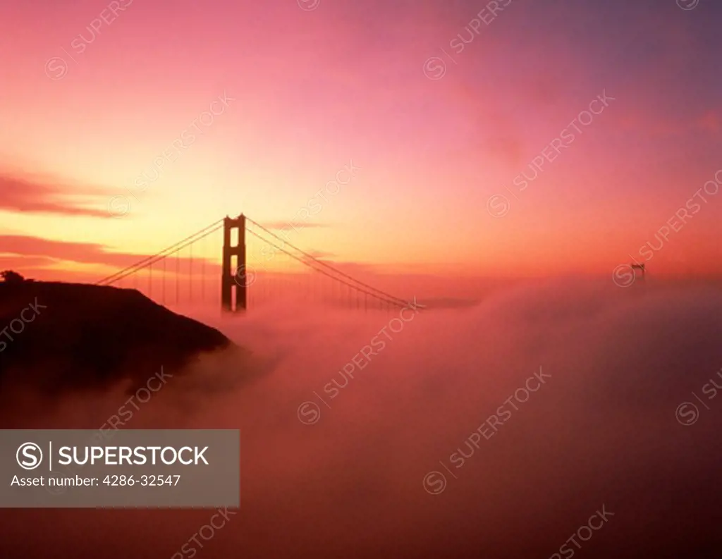 Golden Gate Bridge at sunrise in fog