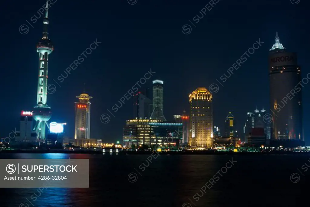 A night skyline of the Pudong Xinqu the New Area from across the Huangpu River in Shanghai China 050203