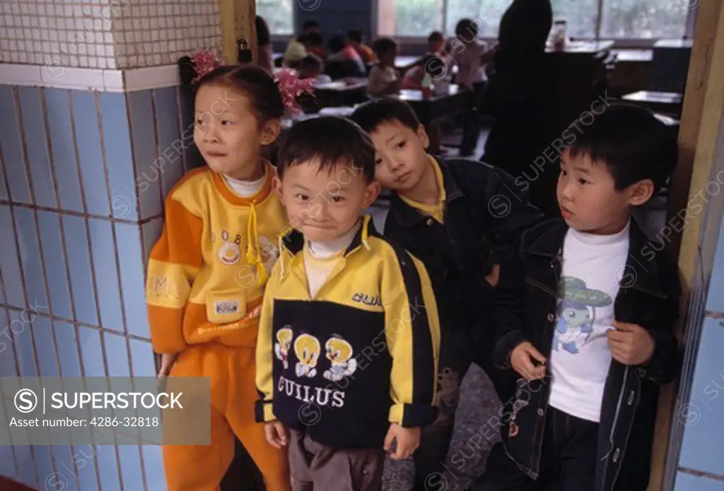 First grade children at classroom door; neighborhood elementary school; Chongqing, China, Asia; 041603