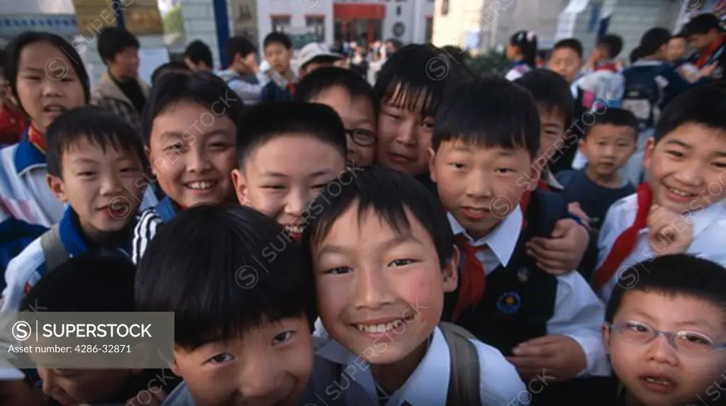 An array of smiling school children in Zigui China