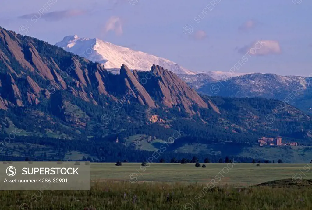 Above NCAR - National Center for Atmospheric Research - the Flatirons formations of the Rocky Mountains, with Longs Peak and Mt. Meeker in the background, CO