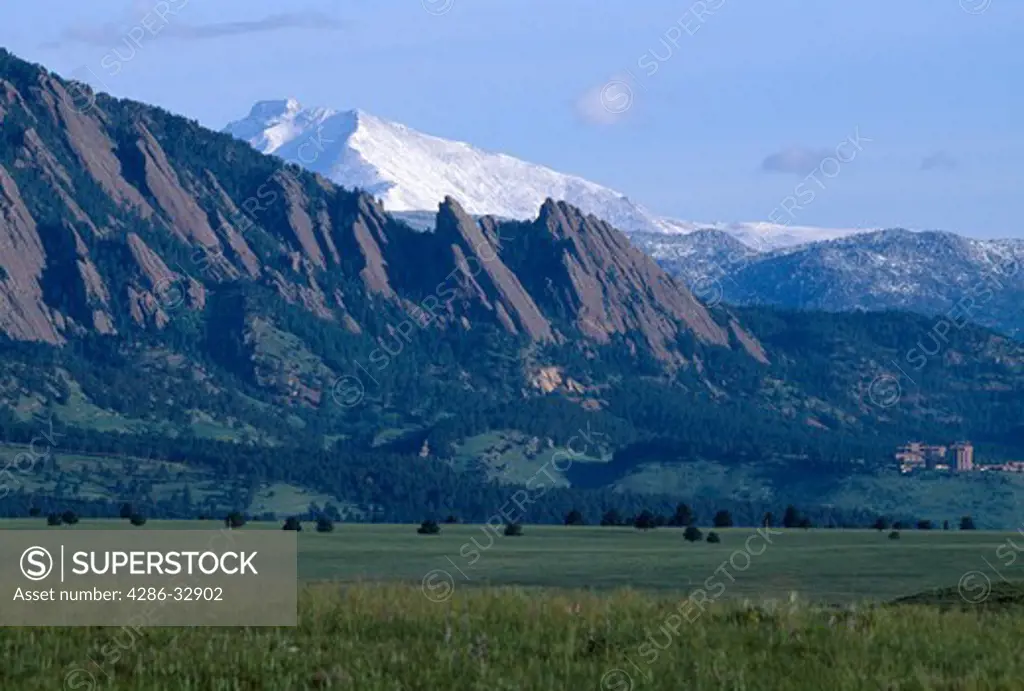 Flatirons formations in foothills w/ Mt Meeker & Longs Peak in background, near Boulder, CO