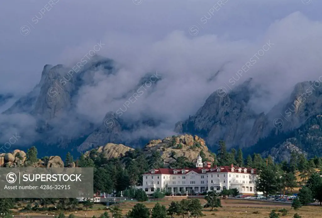 A morning storm looms over the historic Stanley Hotel, hiding Lumpy Ridge in Estes Park, CO