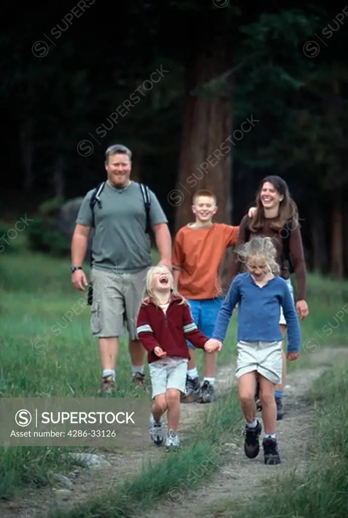 A family of five enjoy a hiking experience in Moraine Park, Rocky Mtn Nat'l Park, CO